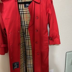 Vintage Burberry’s of London Red trench coat.